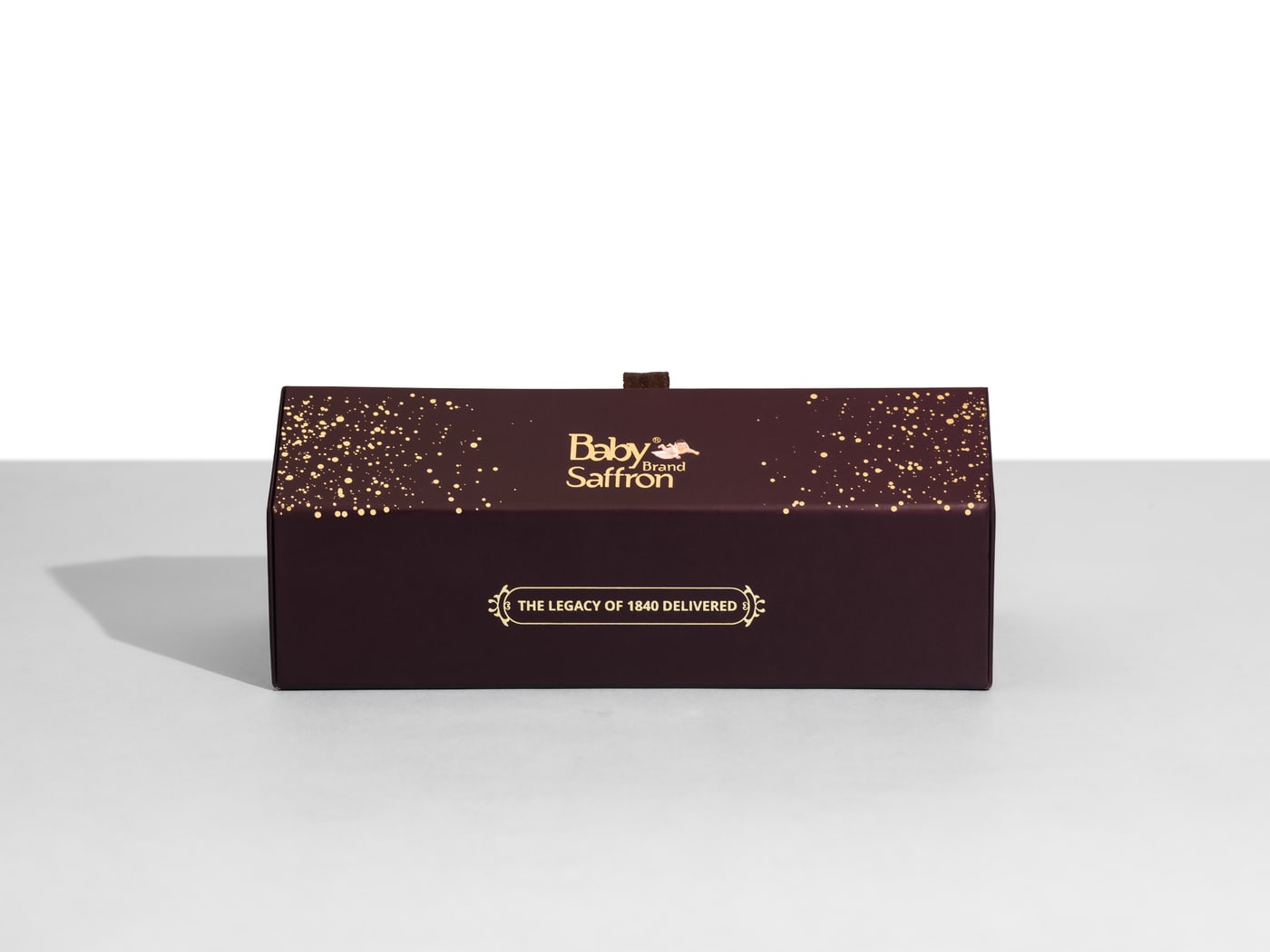 Baby Saffron Triangular Gift Box — closed, gold-flecked deep plum